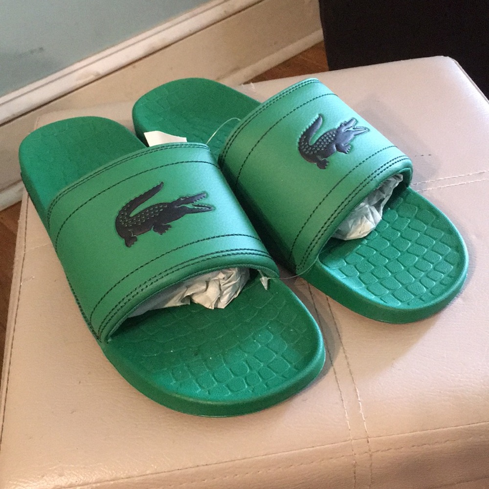 Green Lacoste slides